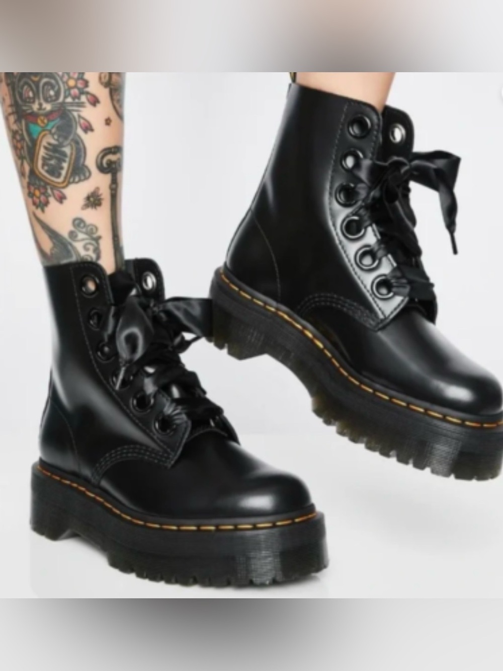 Dr. Martens Molly Platform Boot in black leather. $210